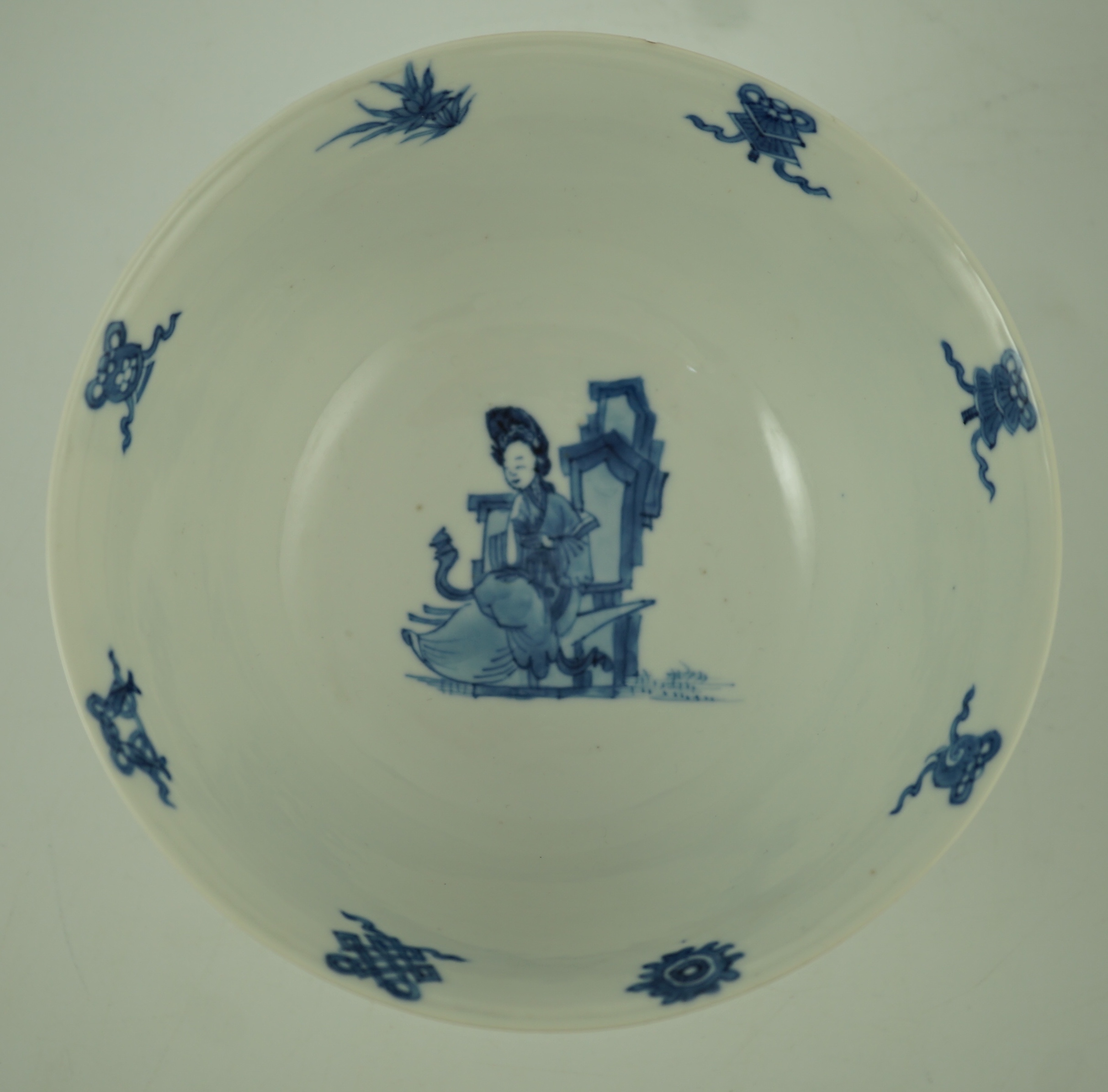 A Chinese blue and white ‘ladies’ bowl, Kangxi period, 15.5cm diameter, wood stand